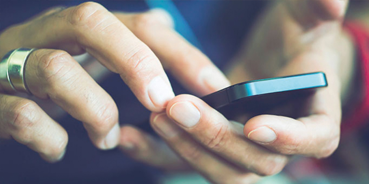 Person typing on their phone